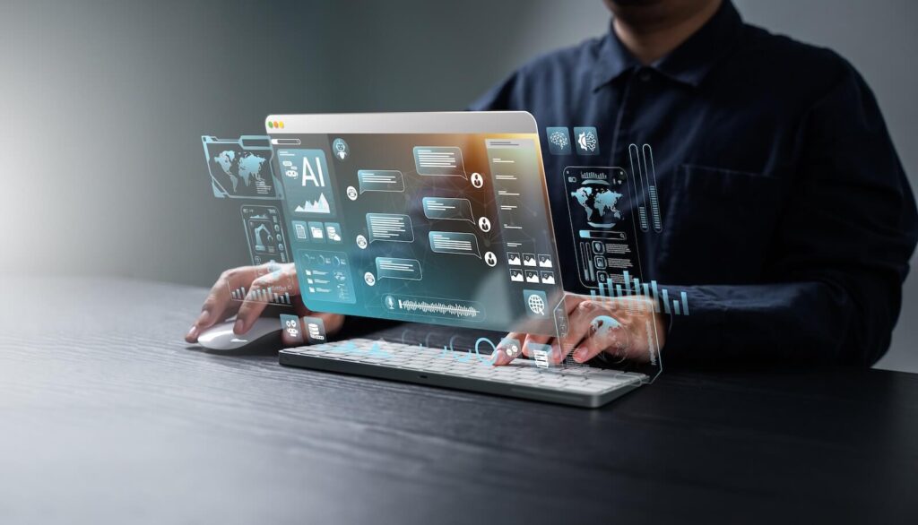 Person using a computer with holographic AI interface displaying charts, maps, and data visualizations, suggesting advanced technology interaction.
