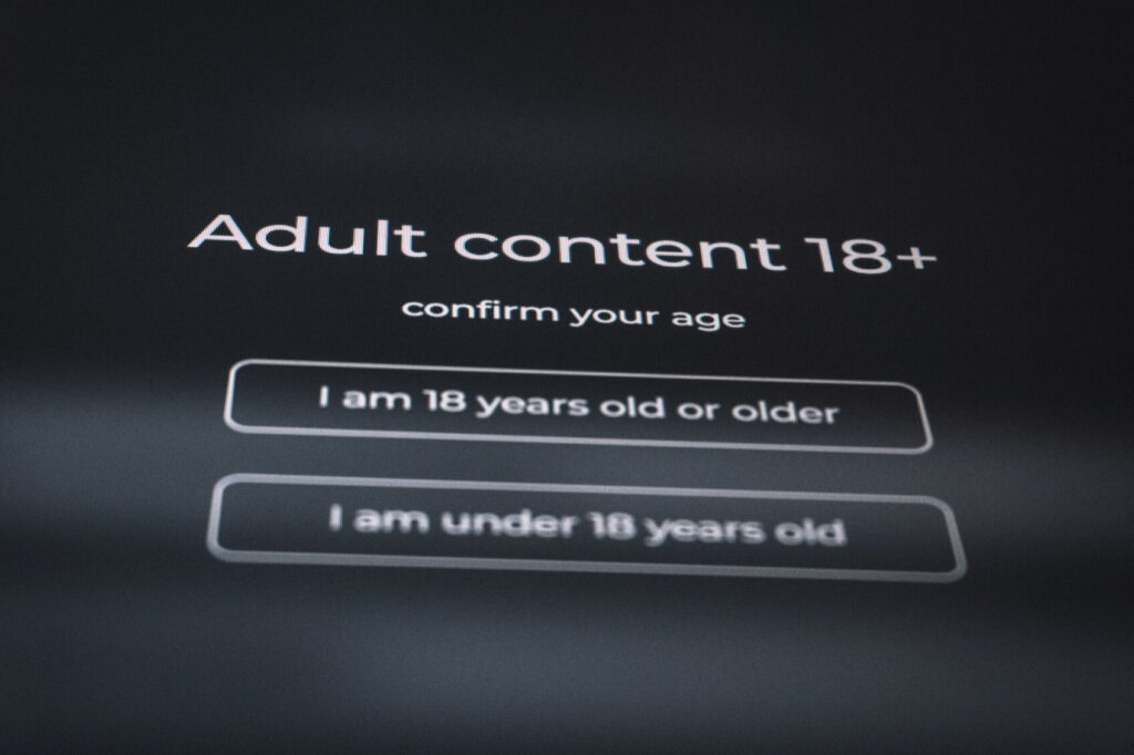 Adult content age verification screen with options: "I am 18 years old or older" and "I am under 18 years old."
