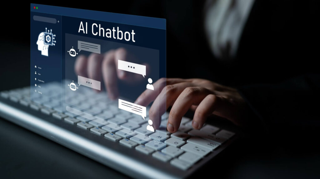 Hands typing on a keyboard with a digital overlay displaying "AI Chatbot" and chat icons on a screen.